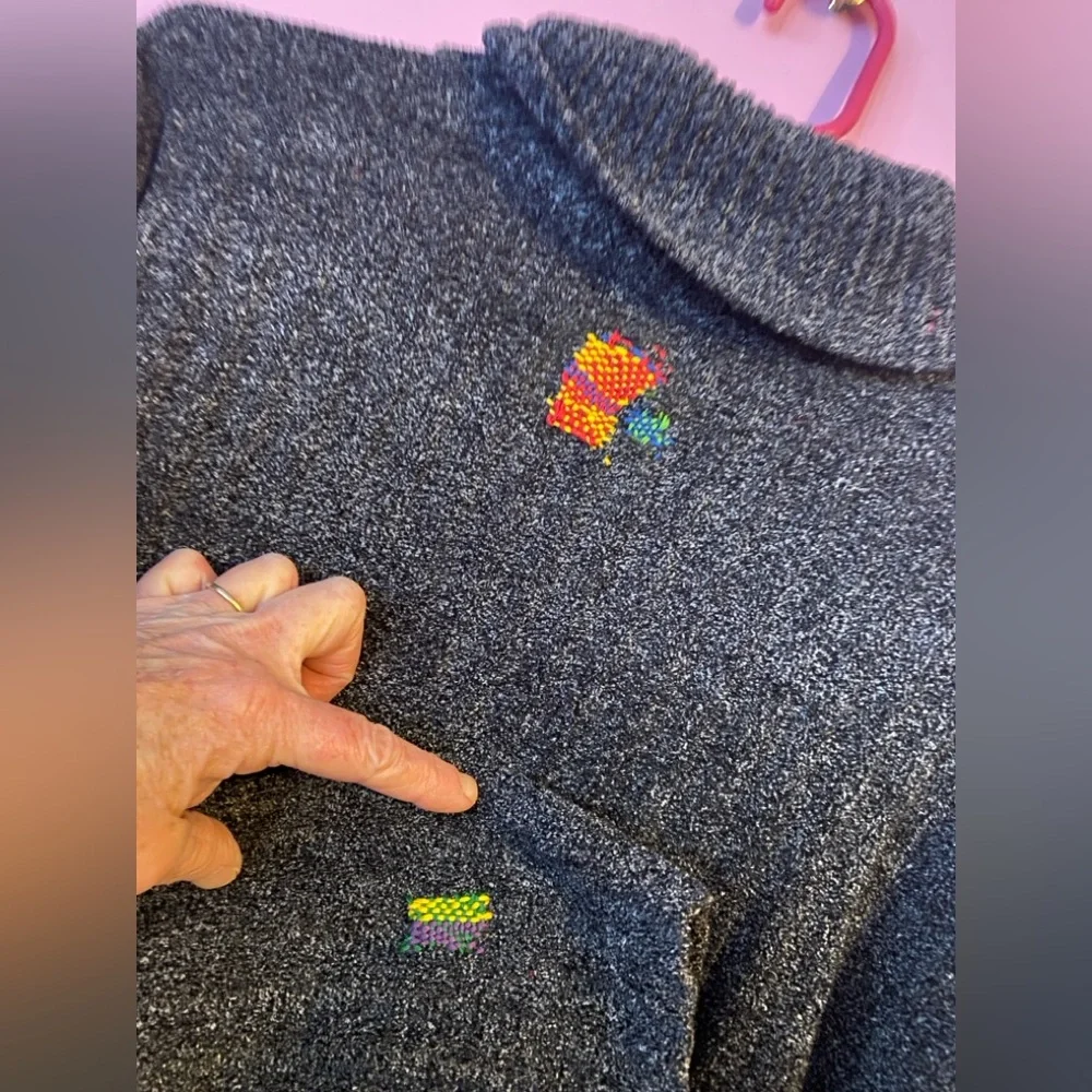 Super Soft Distressed Turtle Neck Sweater with Colorful Repairs.